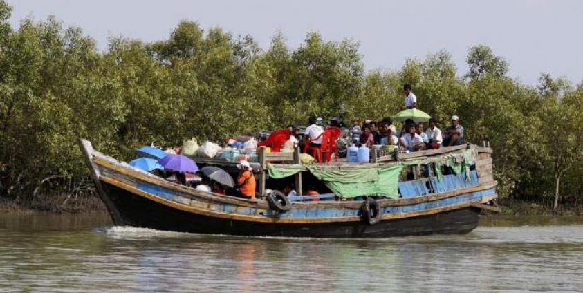  People travelling by boat in Sittwe, Rakhine State, western Myanmar. Photo: Nyein Chan Naing/EPA 