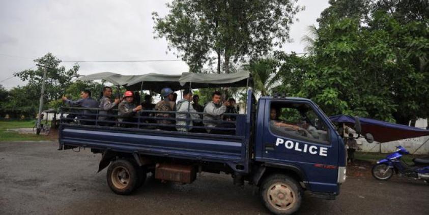 Policemen patrol in a truck the streets of Sittwe, capital of Myanmar's western state of Rakhine. Photo: AFP 