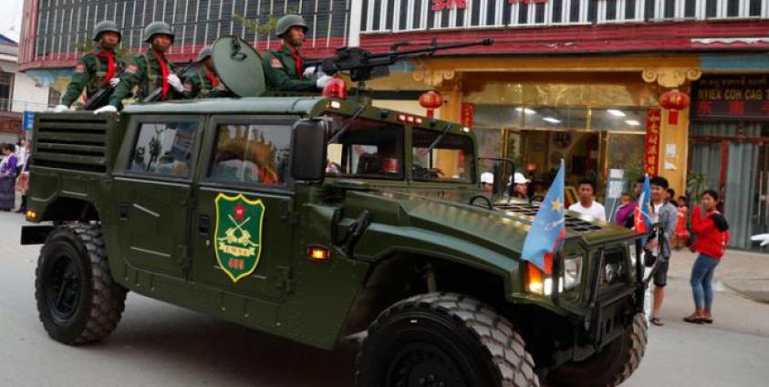 An armored fighting vehicle of the United Wa State Army (UWSA) drives in a downtown area of Panghsang, also called Pang Kham, autonomous Wa region, north-eastern Myanmar, 17 April 2019. Photo: Lynn Bo Bo/EPA