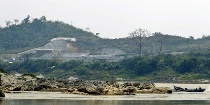 A boat drives pass near the Myitsone dam project at the Irrawaddy Myitsone, Myitkyina, Kachin State. Photo: Nyein Chan Naing/EPA