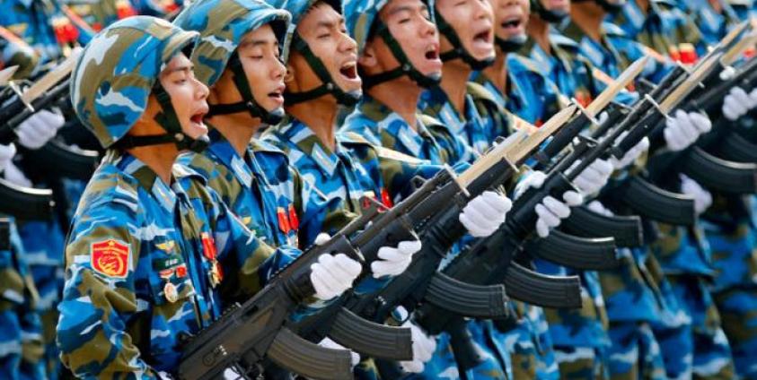 Vietnamese soldiers of an army defense unit march during a parade marking 70th anniversary of National Day at a street in Hanoi, Vietnam. Photo: Minh Hoang/EPA