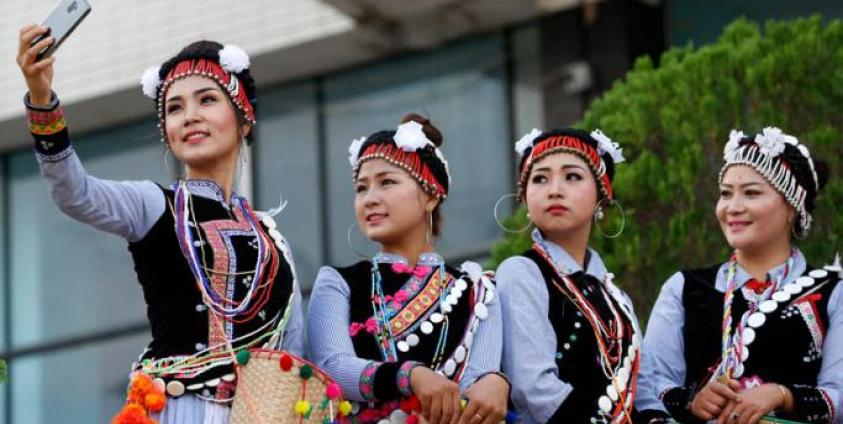 Lisu ethnic women take a selfie during celebrations of the New Year Countdown in Yangon, Myanmar, 31 December 2018. Photo: Nyein Chan Naing/EPA