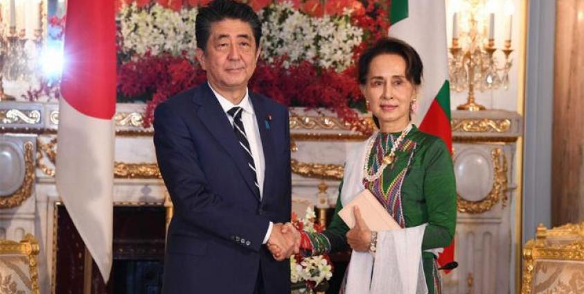 State Counsellor Daw Aung San Suu Kyi shakes hands with Prime Minister of Japan Mr Shinzo Abe at the State Guest House in Tokyo, Japan yesterday. Photo: MNA