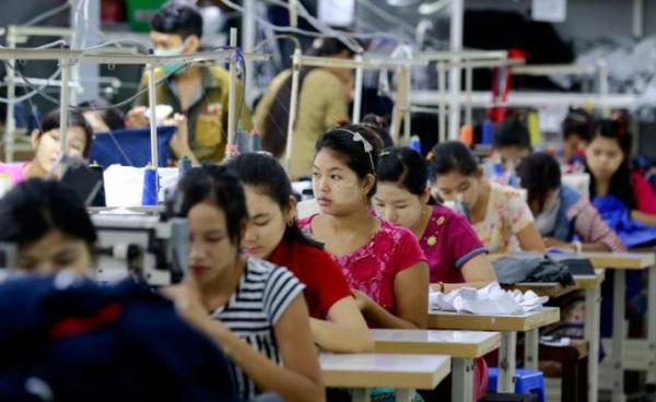 Employees work at a garment factory in Shwe Pyi Thar, Yangon, Myanmar. Photo: Nyein Chan Naing/EPA