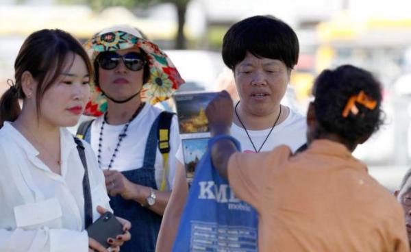 Chinese tourists at the Maha Bandoola park in Yangon, Myanmar. Photo: Nyein Chan Naing/EPA