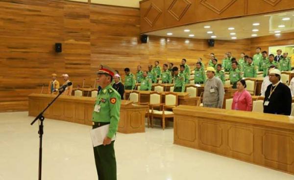 Gen. Hla Oo from the 66th Light Infantry Division (LID-66) takes an oath as the new Shan State Minister for Security and Border Affairs during an emergency session of the Shan State Hluttaw 