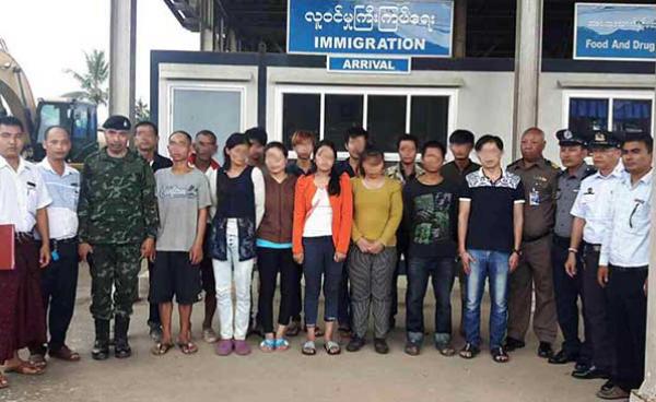 The Thai police hand over 14 migrant workers to Myanmar authorities in Tachileik-Mae Sai border area on July 17 after they were arrested.