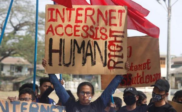 Rakhine University Students hold placards during a protest against the internet shutdown in Sittwe, Rakhine State, Western Myanmar, 22 February 2020. Photo: Nyunt Win/EPA