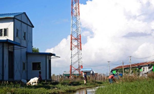 Rakhine children play near a telecommunications tower at Sat Yoe Kya Ward, Sittwe, Rakhine state, Myanmar. Photo: Nyunt Win/EPA