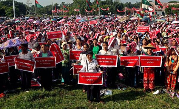 Kachin people hold placards reading 'For a more peaceful day, war is not the way.' and 'Stop civil war in Kachin State' during a protest held to show opposition to the conflict between the Myanmar Army and Kachin Independence Army (KIA) in Kachin State, in Myitkyina, Kachin State, Myanmar, 3 October 2016. Photo: Seng Mai/EPA