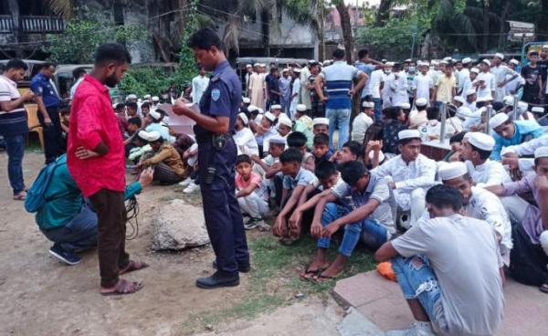 Policeman takes the details of Rohingya refugees who were detained from a beach, at the Sadar Model police station in Cox's Bazar. Bangladesh police detained at least 450 Rohingya refugees as they celebrated the Muslim festival of Eid on a popular beach, officials said on May 5, 2022. Photo: AFP