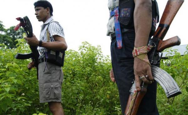 (File) Cadres of the United Liberation Front of Asom (ULFA) stand guard at a hideout camp near Amarpur inTinsukia district, some 600 kms from Guwahati, the capital city of India’s northeastern state of Assam on June 27, 2008. Photo: AFP