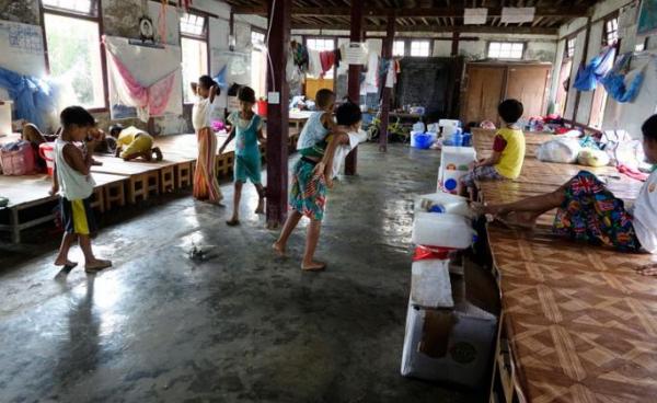 Rakhine ethnic children, who fled from conflict areas, take refuge at A Myo Thar Monastery temporary camp in Sittwe, Rakhine State. Photo: Nyunt Win/EPA