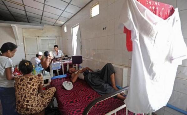 A patient lying on a bed at a charity-run clinic in Yangon. Photo: AFP