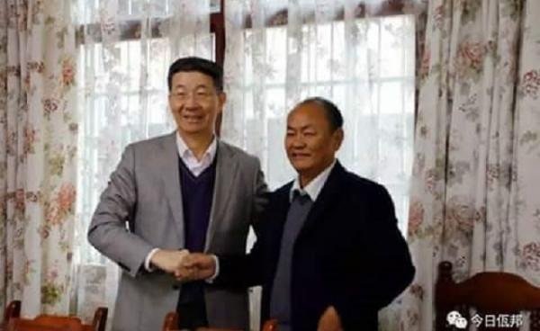 China’s special representative for Burma, Sun Gunxiang (left) and Bao Youxiang, the leader of the United Wa State Army (UWSA) (right).