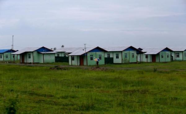 (File) A man walks in front of the newly built houses for resettlement at the Kyauk BanDu village in Maungdaw township, Rakhine State, western Myanmar, 23 August 2018. Photo: Nyein Chan Naing/EPA