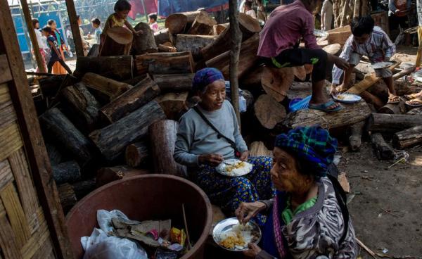 This picture taken on May 11, 2018 shows internally displaced people in a church compound in Myitkyina after fleeing conflict between government troops and ethnic armed group in Kachin state. Photo: Ye Aung Thu/AFP