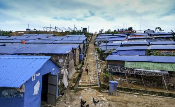 A Rohingya child walks down from a hill at Kutupalong refugee camp in Ukhia on July 24, 2019. Photo: Munir Uz Zaman/AFP 