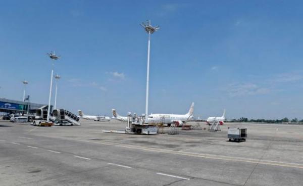 Myanmar National Airlines (MNA) aircraft parked on the tarmac as commercial flights remain temporarily suspended as part of the measures to control the spread of the COVID-19 coronavirus disease, at Yangon International Airport in Yangon, Myanmar, 10 May 2020.  Photo: EPA