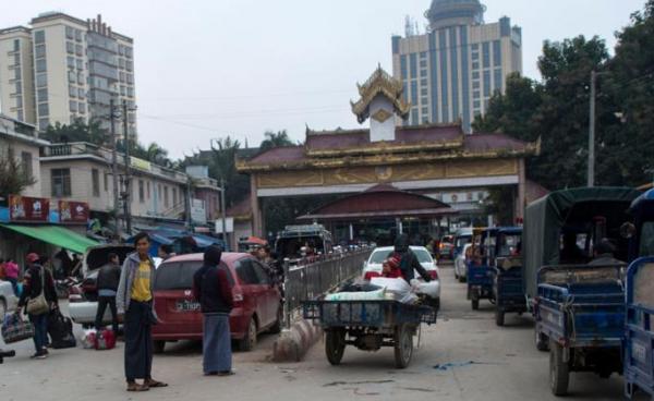 People at the Muse town border gate in Myanmar's Shan State as they wait to cross into China. Photo: Ye Aung Thu/AFP