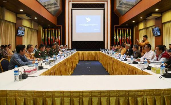 Government delegation and ten Ethnic Armed Organizations hold a preliminary coordination meeting yesterday at the National Reconciliation and Peace Centre in Yangon. Photo: MNA