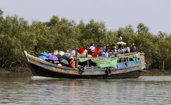  People travelling by boat in Sittwe, Rakhine State, western Myanmar. Photo: Nyein Chan Naing/EPA 