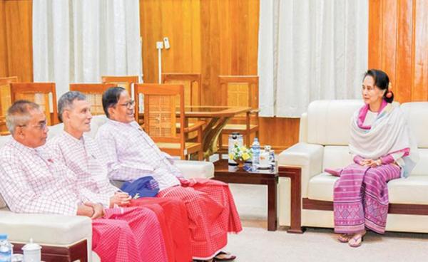 State Counsellor Daw Aung San Suu Kyi meets with New Mon State Party Chairman Nai Han Thar and party at the NRPC in Nay Pyi Taw on January 30. Photo: MNA