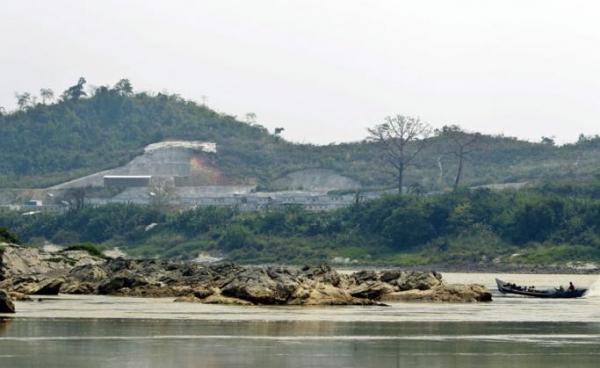 A boat drives pass near the Myitsone dam project at the Irrawaddy Myitsone, Myitkyina, Kachin State. Photo: Nyein Chan Naing/EPA