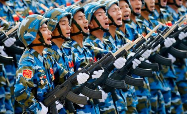 Vietnamese soldiers of an army defense unit march during a parade marking 70th anniversary of National Day at a street in Hanoi, Vietnam. Photo: Minh Hoang/EPA